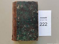 Front cover showing leather spine and marbled boards