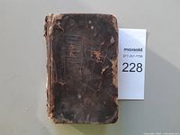 Front cover showing worn leather binding