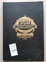 Front cover showing title crest and black board