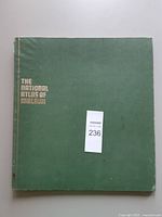 Front cover showing green boards and gilt title