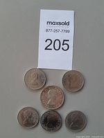 Obverse view of six Canadian dollars showing Queen Elizabeth II portraits