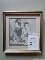 Overall view of framed drawing behind glass