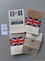 All four folded pamphlets showing variants and Union Jack graphics