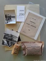 Lot overview showing pamphlet, photos, field dressing and bandage