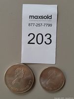 Obverse of both coins with Elizabeth II portrait and 1973 date