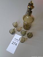 Top view of decanter with stopper and six glasses