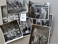 All nine photographs spread out, showing variety of men’s shop display shots