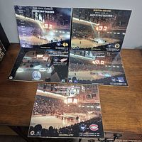 All five photo prints laid out on table showing logos and titles