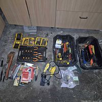 Group shot of all tools, trays, sander, bit sets, pliers and hardware