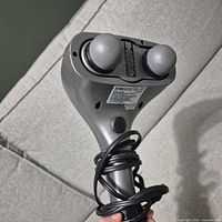 Front of Homedics dual-head percussion massager showing massage nodes