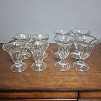 all eight tulip flare glasses on wooden surface