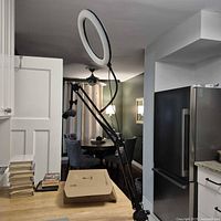 Assembled ring light on boom arm clamped to counter