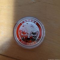 Reverse of 2013 Canadian $10 silver coin with coloured partridge design