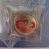 Coin sealed in plastic, obverse side visible