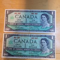 Fronts of both 1967 Centennial $1 notes