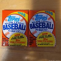 Front view of both sealed 1988 Topps packs showing graphics and 1988 issue year