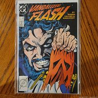 Front cover of The Flash #14 comic in bag