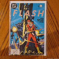 Front cover of The Flash #18 comic in bag and board
