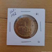 Reverse of 1992 Canada 125th Anniversary dollar coin in flip