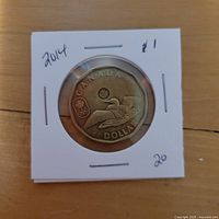 Reverse side of 2014 Canadian Olympic Lucky Loonie in 2×2 flip