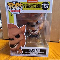 Front view of boxed Funko Pop Rahzar #1137