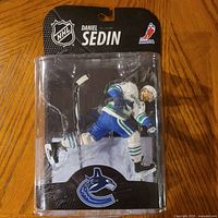 Front view of sealed McFarlane Daniel Sedin figure in package