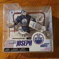 Front view of sealed McFarlane Curtis Joseph figure in package