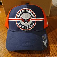 Front view of navy and red Adidas Washington Capitals cap showing embroidered logo and side branding
