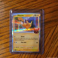 Front view of Pikachu reverse holo card in plastic sleeve