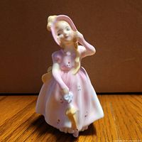 Front view of Babie HN2121 figurine showing attire and parasol