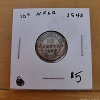 Reverse of coin showing 10 Cents 1945 Newfoundland legend in holder