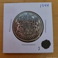 Reverse of 1944 Canada 50 ¢ coin in holder