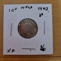 Obverse reverse views of 1942 Newfoundland 10 cent silver coin in holder showing legends, date, denomination