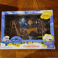 Front view of sealed Smurf Village Construction Adventure Pack box showing Handy Smurf and accessories