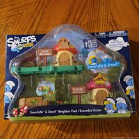 Front view of sealed Smurfs Micro Village Smurfette & Smurf Neighbor Pack in blister packaging