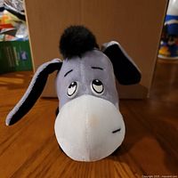 front view of grey donkey plush