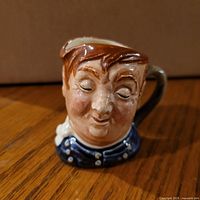 Front view of Royal Doulton Fat Boy miniature Toby mug.