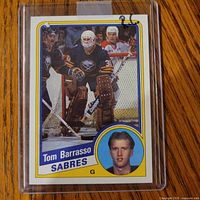 Front of 1984-85 Topps Tom Barrasso rookie card in plastic holder