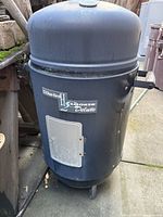 Front view of Char-Broil H2O Smoker Deluxe showing lid, body, handles and front access door