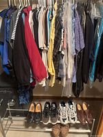 Full closet view showing hanging garments and shoes
