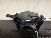 Overall view of Bella rotating waffle maker on stand