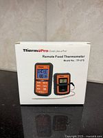 Front view of boxed ThermoPro TP-07S remote food thermometer