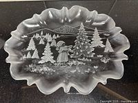 Top view of entire Mikasa oval platter showing scalloped edge and winter scene motif