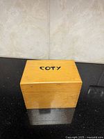 Closed Coty wooden box front view