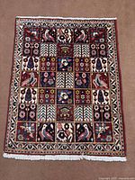 Full view of entire Bakhtiyar rug showing overall design and fringed ends