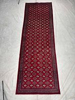 Full length view of red Torkaman runner rug