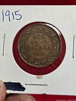 Reverse of 1915 Canadian large cent in holder