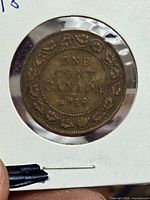 Reverse showing ONE CENT CANADA 1918 within maple-leaf border