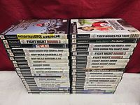 Two stacks of PS2 sports games showing overall quantity