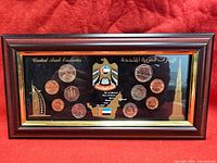 Full view of framed UAE coin display